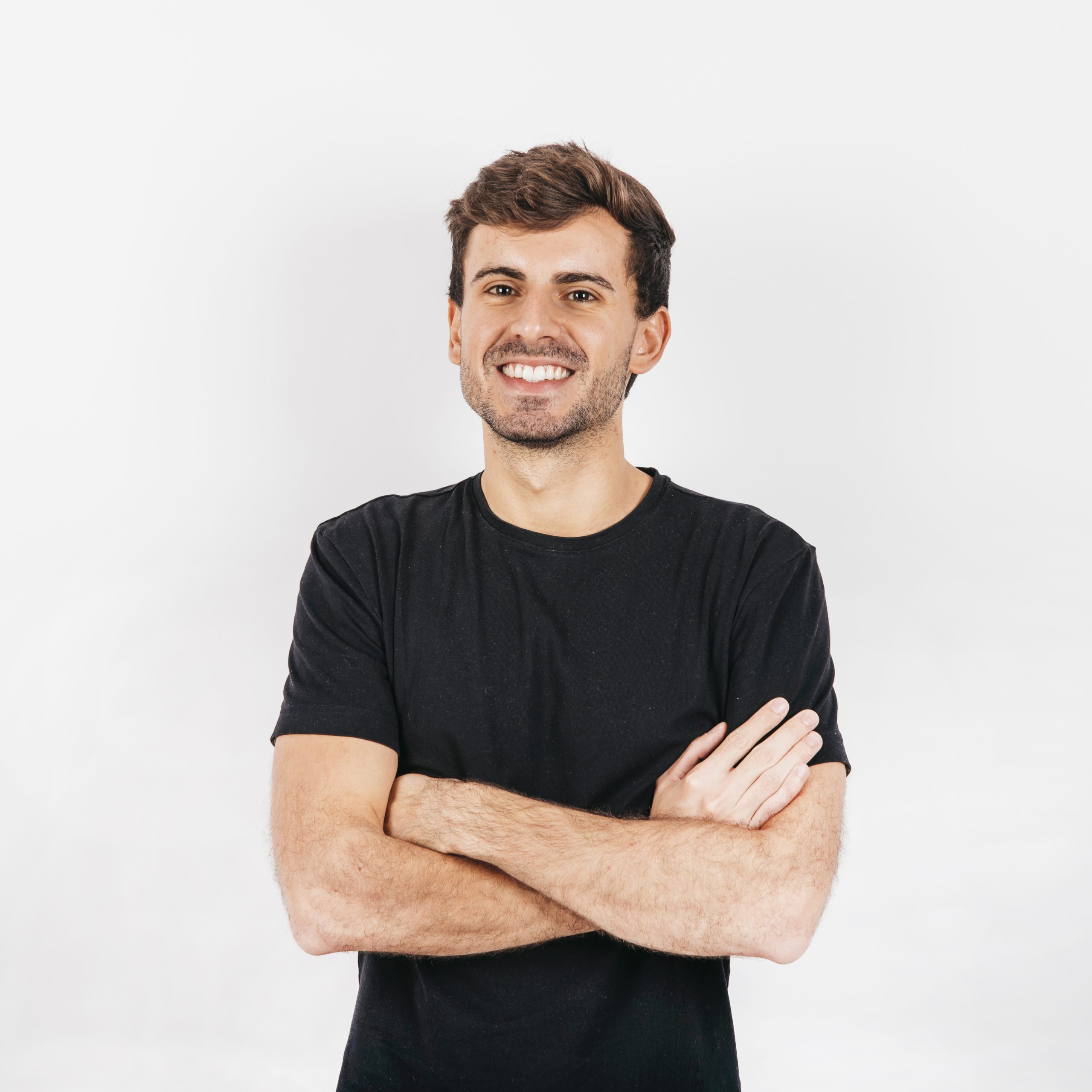 handsome-young-man-with-arms-crossed-white-background