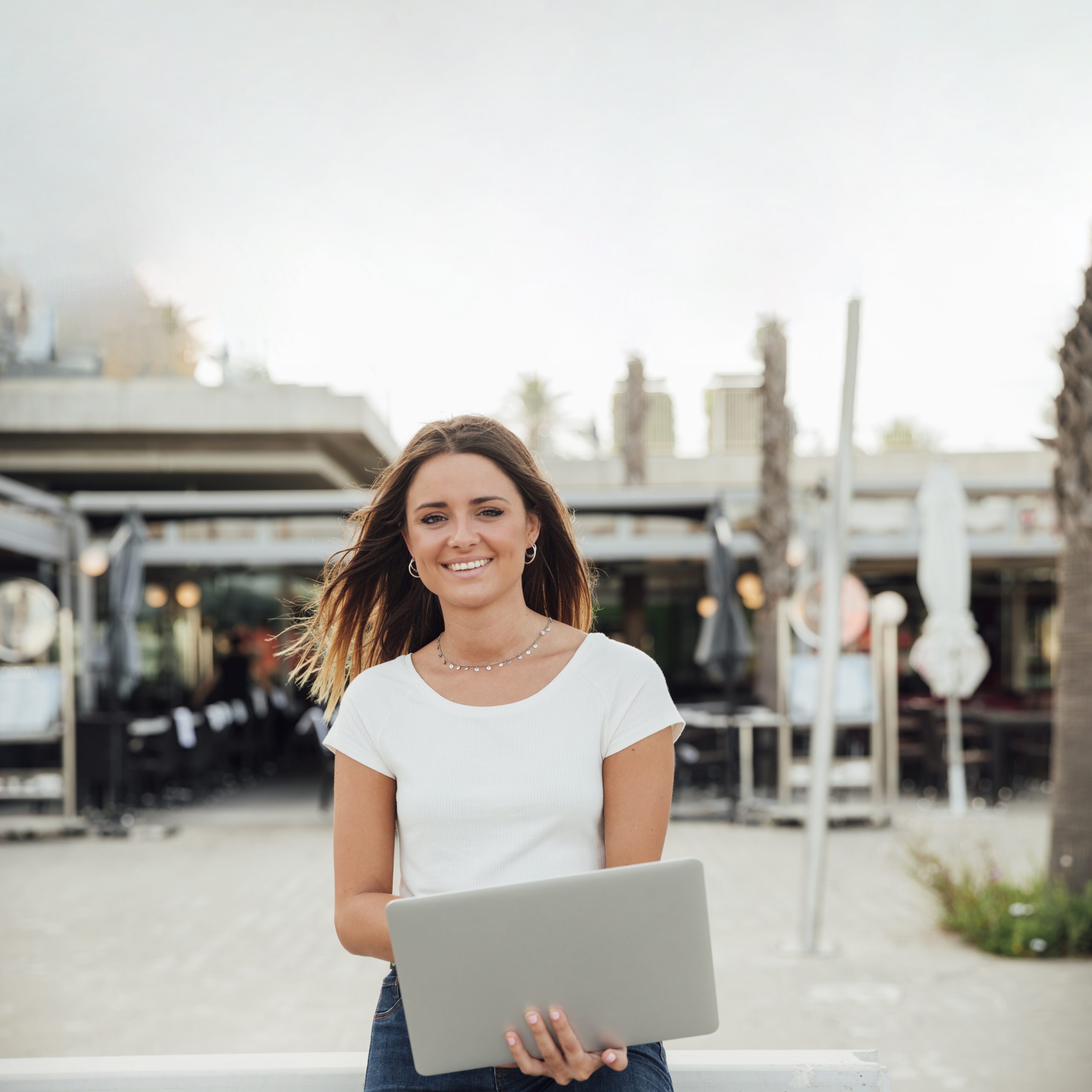 smiley-girl-with-notebook-looking-camera